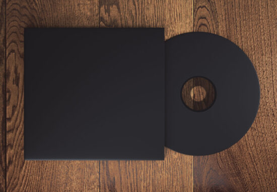 Topview of blank black compact disk with cover on wooden table. Mock up, 3D Rendering